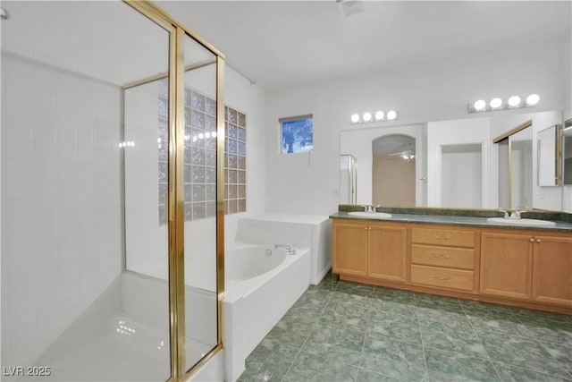 bathroom featuring shower with separate bathtub, vanity, and ceiling fan