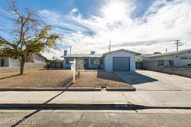 single story home featuring a garage