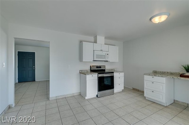 kitchen with white cabinets, light stone countertops, and electric stove