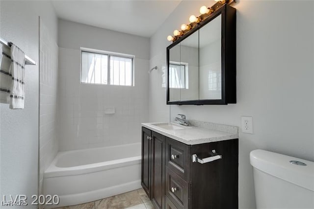 full bathroom featuring shower / bathing tub combination, vanity, toilet, and tile patterned floors