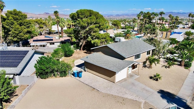 birds eye view of property featuring a mountain view