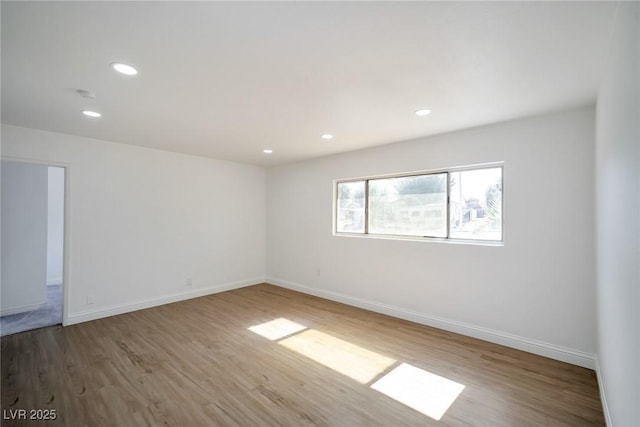 empty room featuring hardwood / wood-style flooring