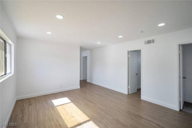 spare room featuring hardwood / wood-style flooring