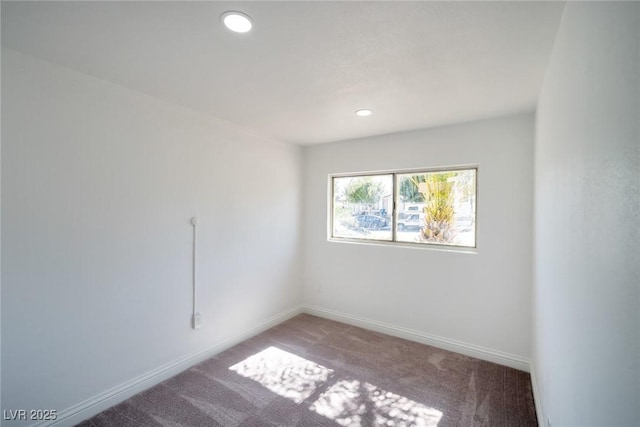 spare room featuring carpet floors