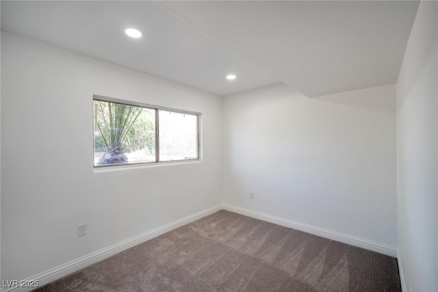 unfurnished room featuring carpet