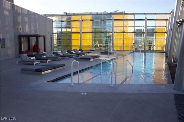 view of swimming pool with a patio area