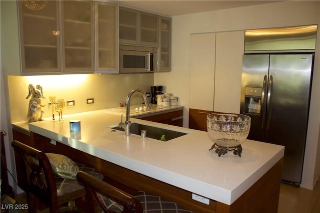 kitchen featuring stainless steel appliances and sink