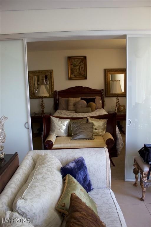 tiled bedroom with a closet