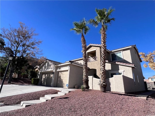 view of front of house featuring a garage and a balcony