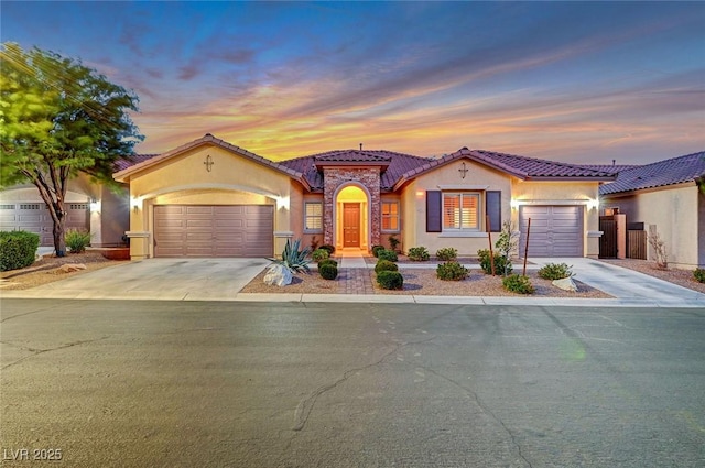 mediterranean / spanish-style home featuring a garage