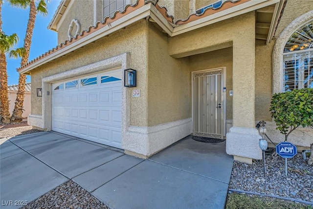 entrance to property featuring a garage