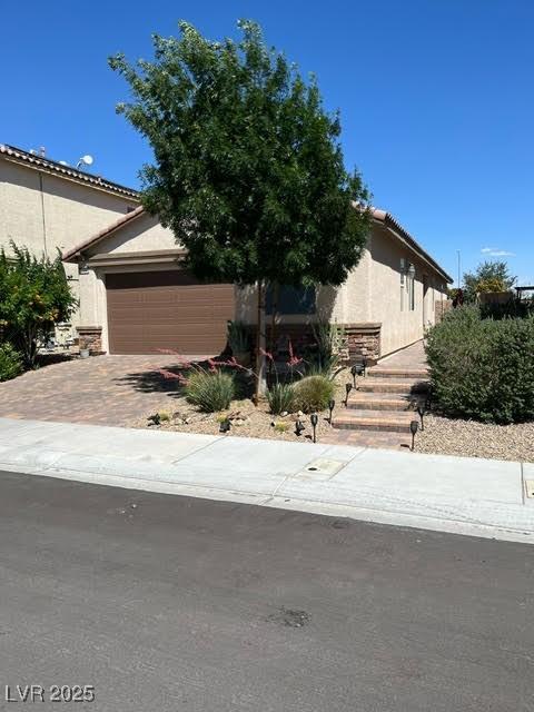 obstructed view of property featuring a garage