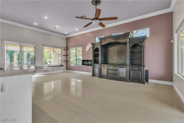 unfurnished living room featuring ceiling fan and crown molding