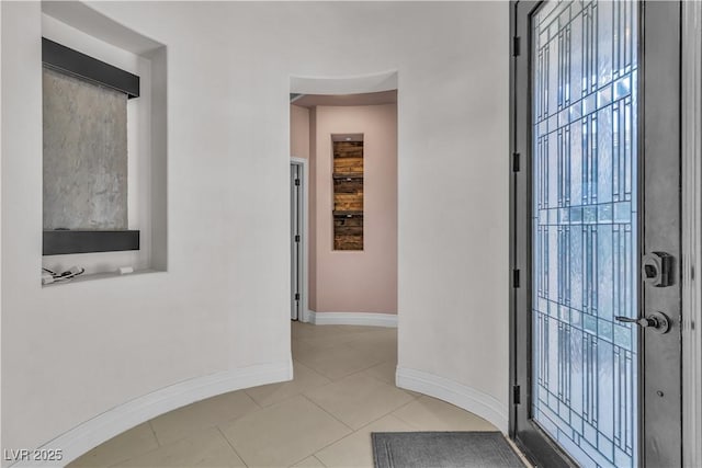 foyer with light tile patterned floors