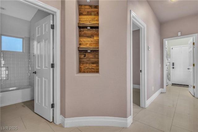 corridor with light tile patterned flooring