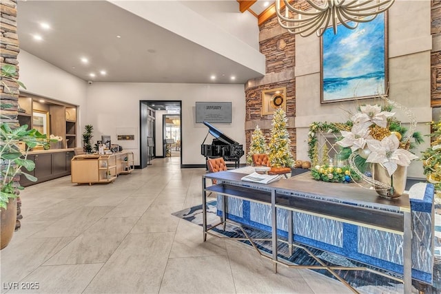 interior space featuring beamed ceiling and high vaulted ceiling