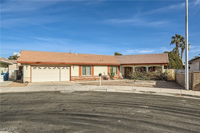 ranch-style house featuring a garage