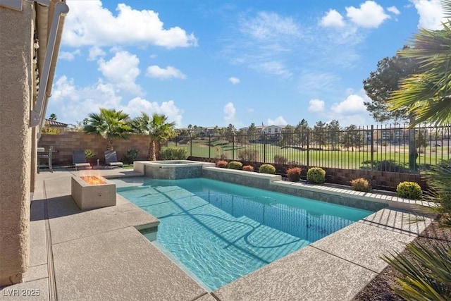 view of pool with an in ground hot tub and an outdoor fire pit