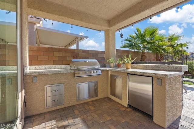 view of patio / terrace with a grill and area for grilling