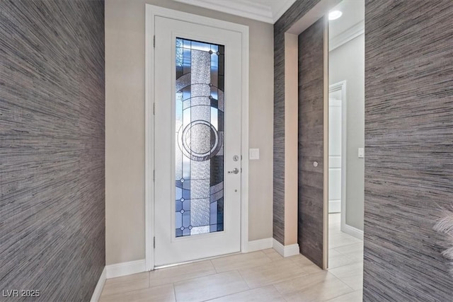 tiled foyer featuring ornamental molding