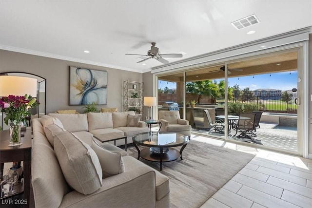 living room featuring plenty of natural light, ceiling fan, and crown molding