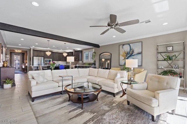 living room with beam ceiling, ceiling fan, and ornamental molding