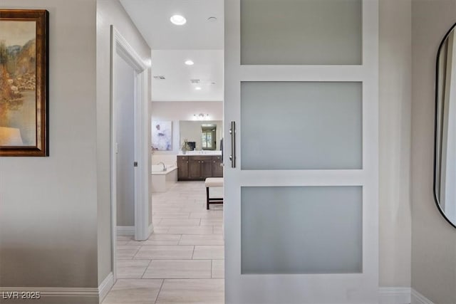 hallway with light tile patterned flooring