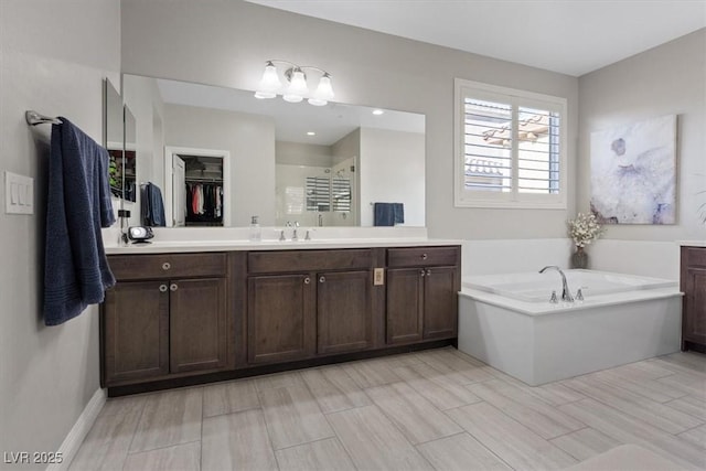 bathroom with vanity and plus walk in shower