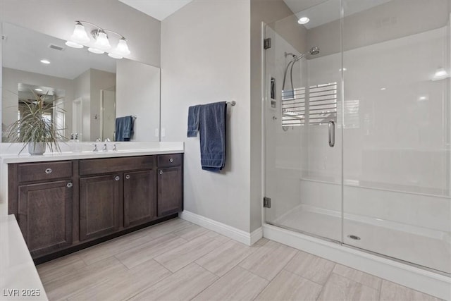 bathroom with vanity and walk in shower