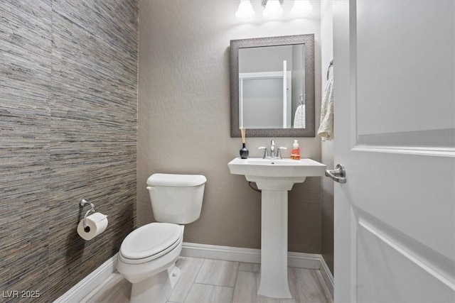 bathroom with sink and toilet