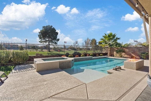 view of pool with an in ground hot tub