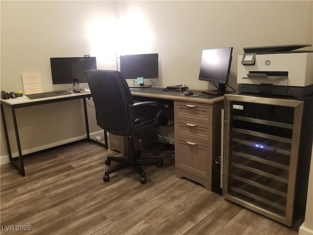 home office with wine cooler and dark wood-type flooring