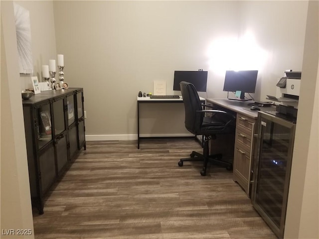 office space with dark hardwood / wood-style floors and beverage cooler