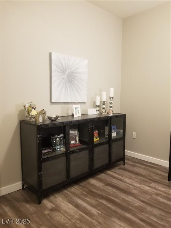 bar with dark hardwood / wood-style floors