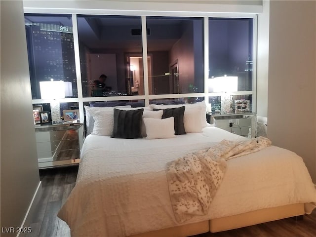 bedroom featuring dark hardwood / wood-style floors