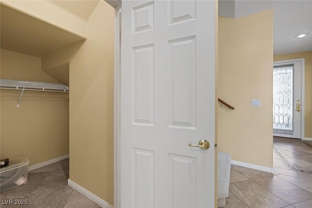 spacious closet featuring light tile patterned flooring