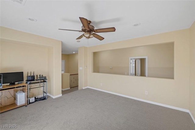 unfurnished living room featuring carpet floors and ceiling fan