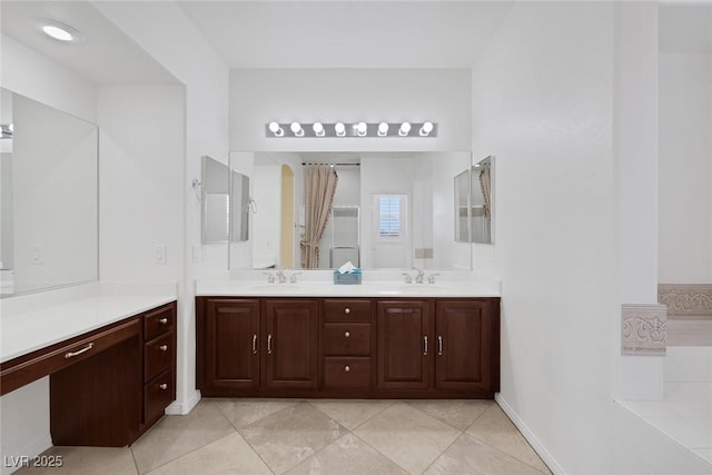 bathroom with vanity and tile patterned floors