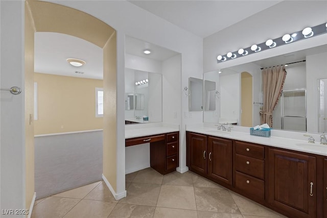 bathroom with tile patterned floors and vanity