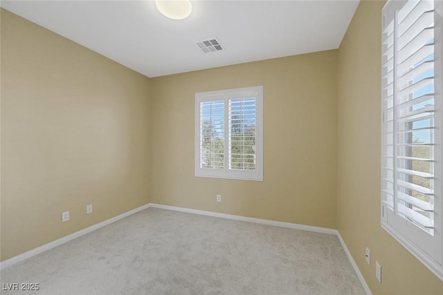 empty room featuring light carpet