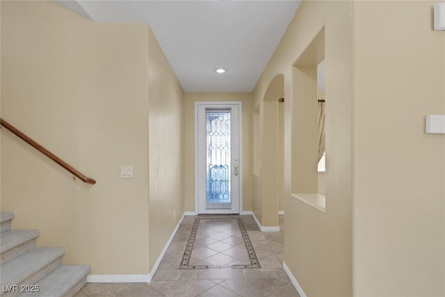 entryway with light tile patterned floors