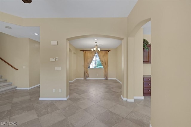 foyer with a notable chandelier