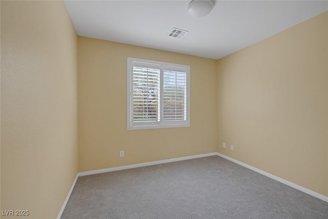 empty room with light colored carpet