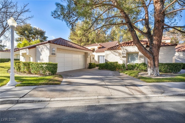 mediterranean / spanish-style house featuring a garage