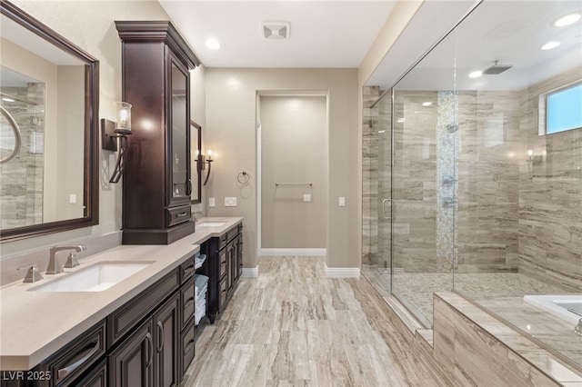 bathroom with plus walk in shower and vanity