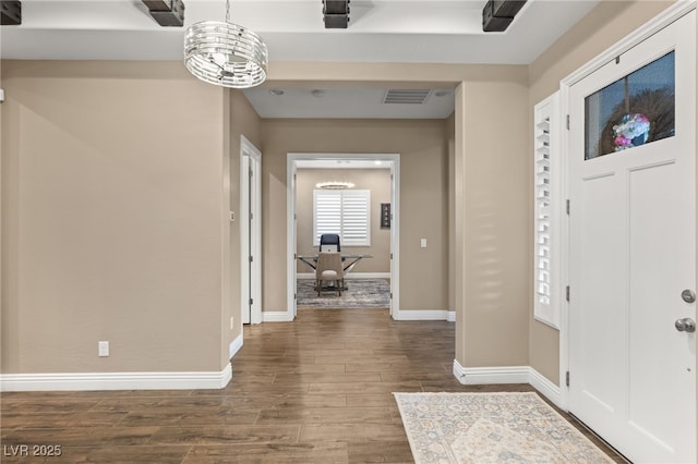 entrance foyer with an inviting chandelier