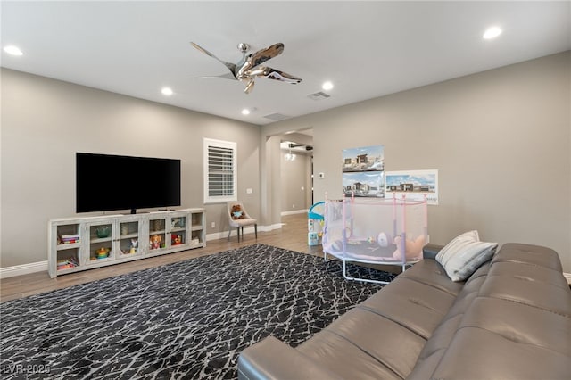 living room with ceiling fan