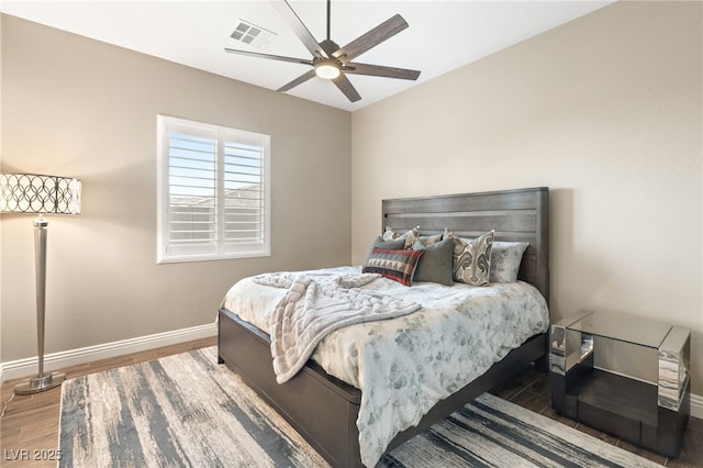 bedroom with hardwood / wood-style flooring and ceiling fan