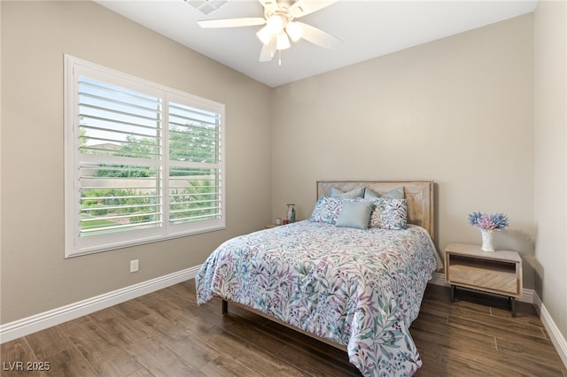 bedroom featuring hardwood / wood-style floors and ceiling fan