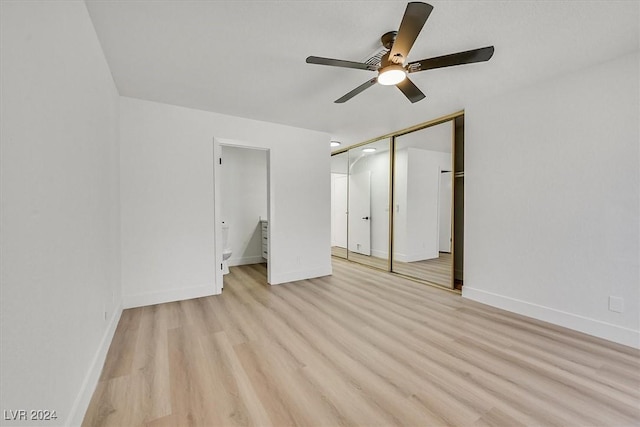 unfurnished bedroom featuring ceiling fan, a closet, and light hardwood / wood-style floors